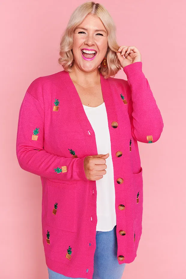 Angela Plants On Pink Cardi