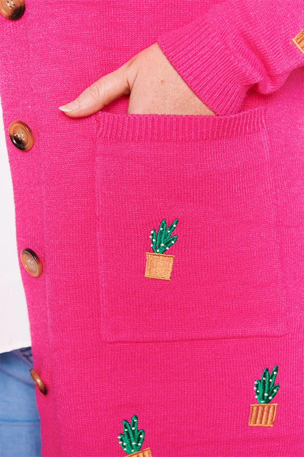 Angela Plants On Pink Cardi