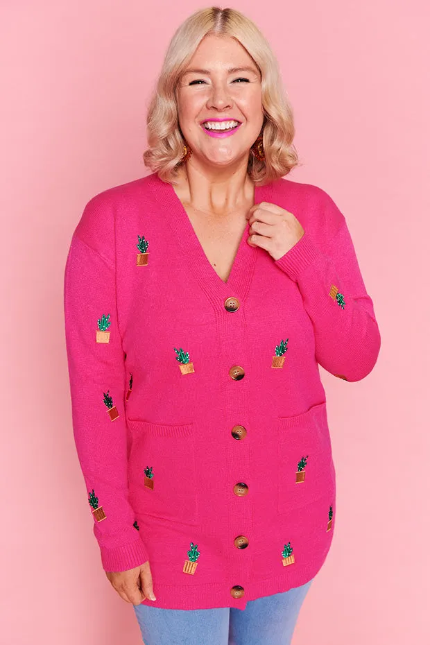 Angela Plants On Pink Cardi