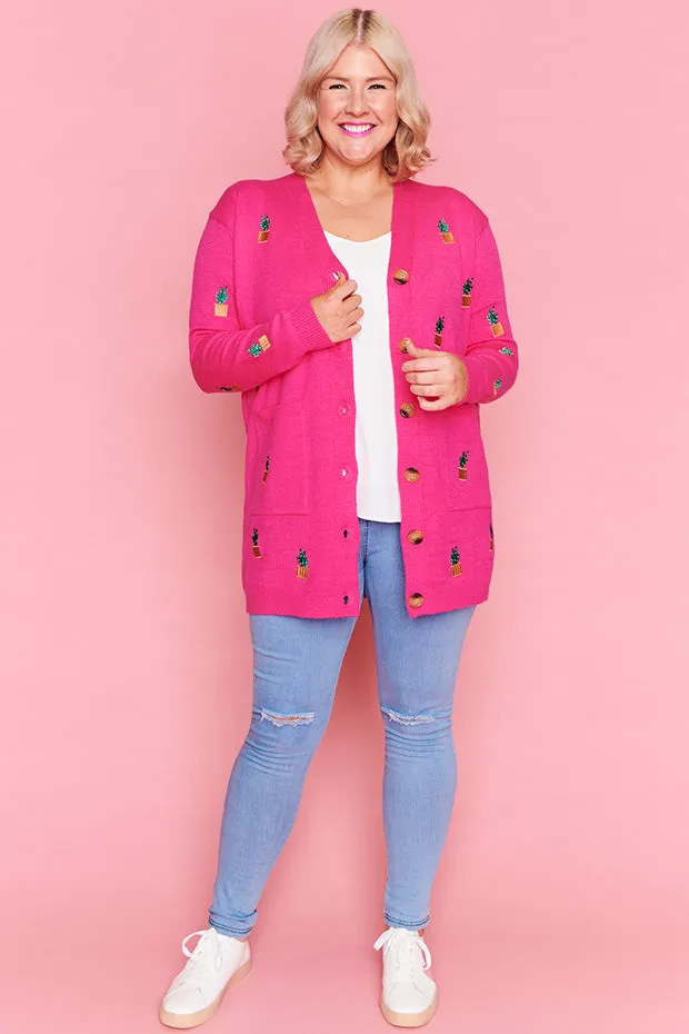 Angela Plants On Pink Cardi