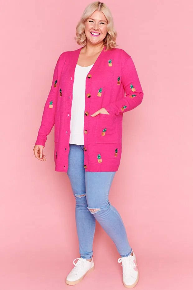 Angela Plants On Pink Cardi