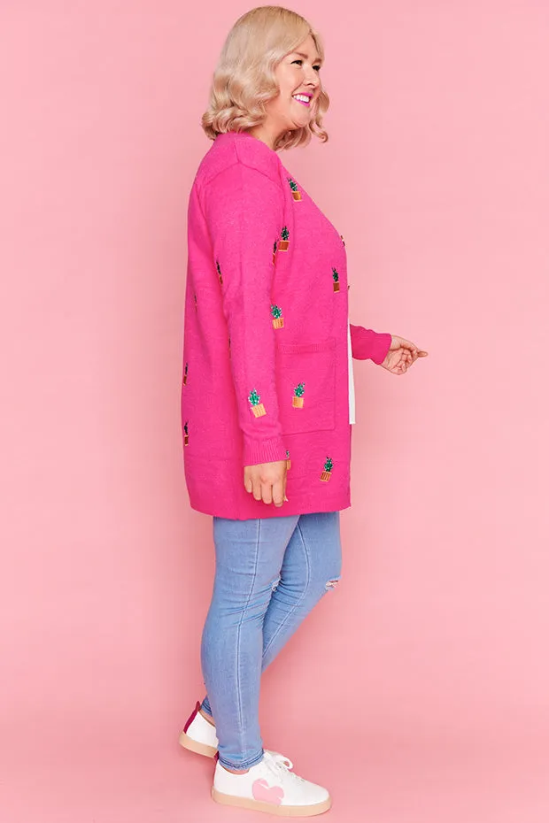 Angela Plants On Pink Cardi
