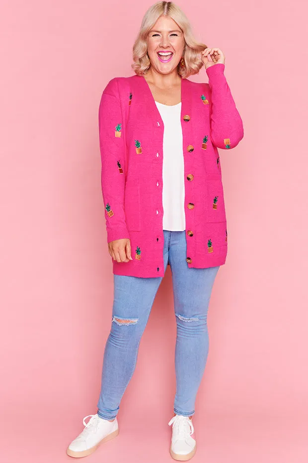 Angela Plants On Pink Cardi