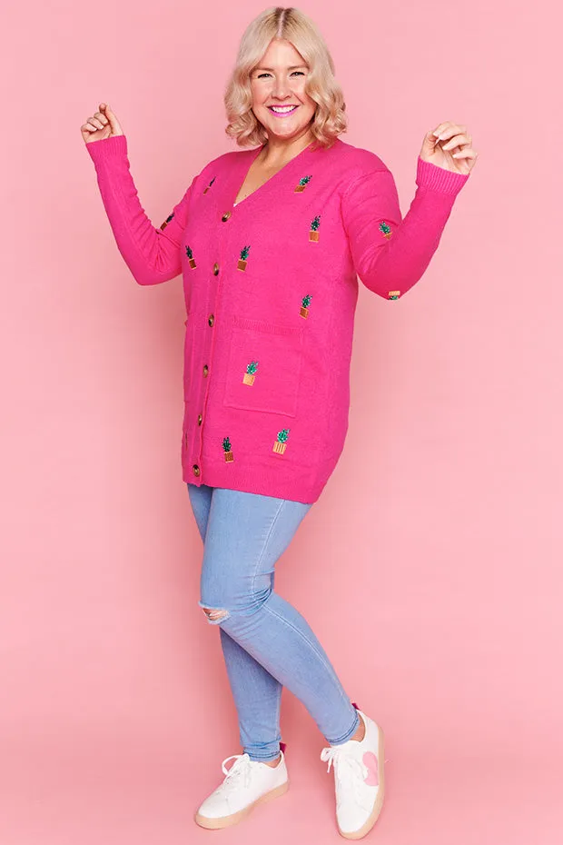 Angela Plants On Pink Cardi