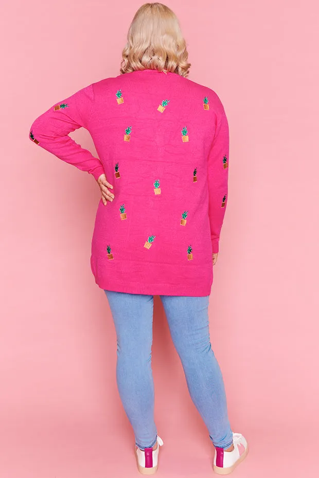 Angela Plants On Pink Cardi